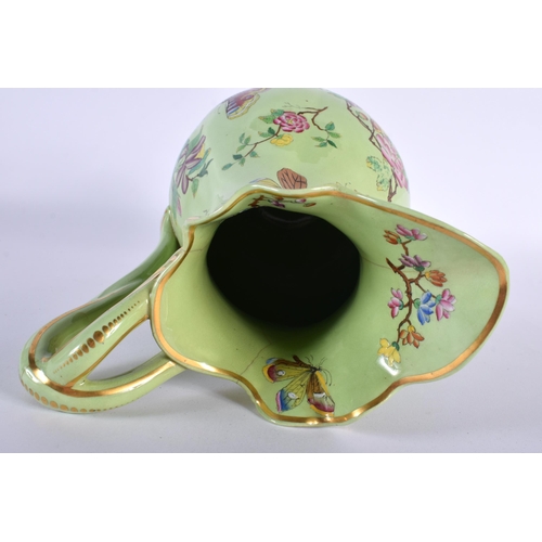 18 - AN EARLY VICTORIAN ENAMELLED BUTTERFLY JUG. 27 cm high.