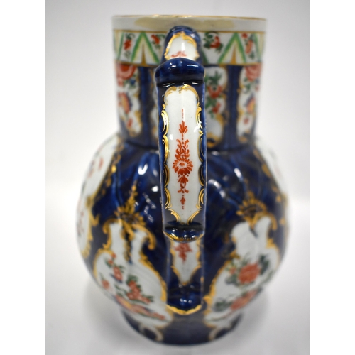 183 - 18th century Worcester mask jug painted in kakiemon style with two panels one with flowers, the othe... 