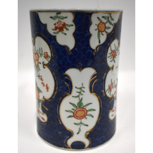 184 - 18th century Worcester mug painted in kakiemon style with two panels of oriental flowers on a blue s... 