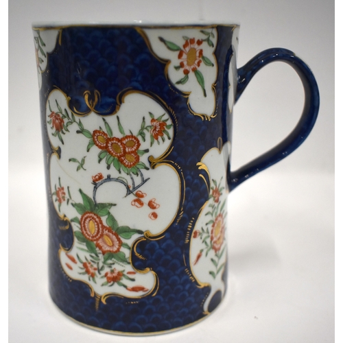 184 - 18th century Worcester mug painted in kakiemon style with two panels of oriental flowers on a blue s... 