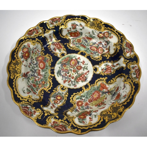 185 - 18th century Worcester silver shaped plate with blue scale ground,having gilt panels with Kakiemon f... 