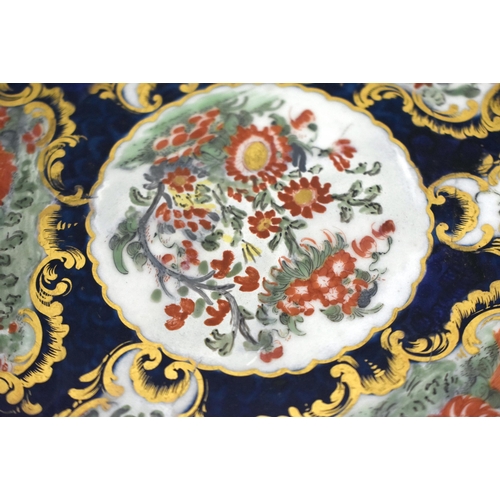 185 - 18th century Worcester silver shaped plate with blue scale ground,having gilt panels with Kakiemon f... 