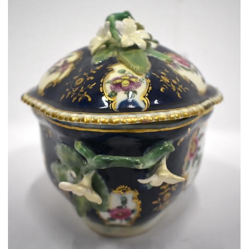 189 - 18th century blue scale tureen and cover painted with flowers, the cover and base with twig handles ... 