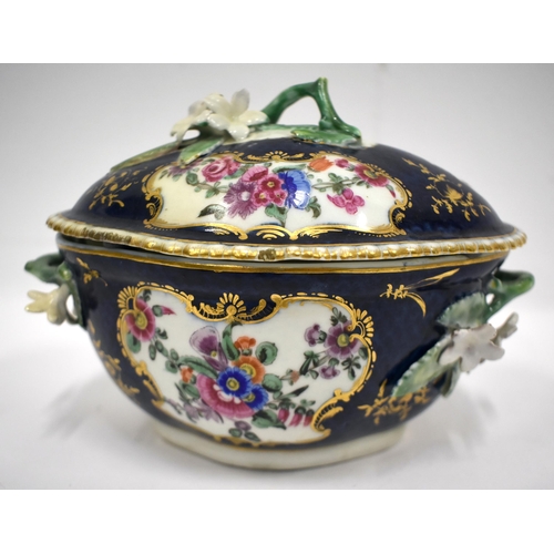 189 - 18th century blue scale tureen and cover painted with flowers, the cover and base with twig handles ... 