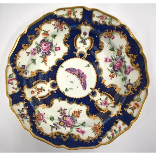 192 - 18th century Worcester shell shaped dish painted with flower on a blue scale ground and a similar si... 