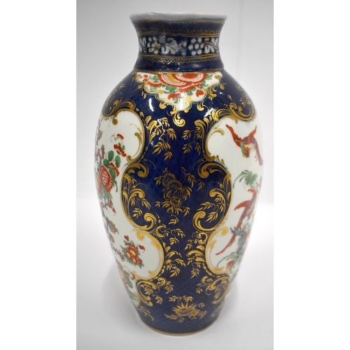 193 - 18th century Worcester vase painted in kakiemon style on a blue scale ground 26cm high