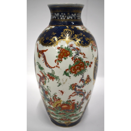 193 - 18th century Worcester vase painted in kakiemon style on a blue scale ground 26cm high