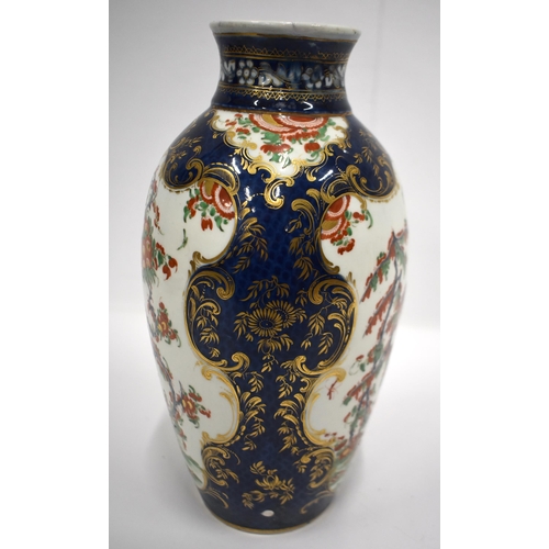 193 - 18th century Worcester vase painted in kakiemon style on a blue scale ground 26cm high