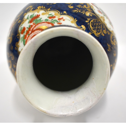 193 - 18th century Worcester vase painted in kakiemon style on a blue scale ground 26cm high