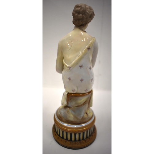 194 - 19th century porcelain figure of a girl sitting on a plinth, wave mark in blue to base, probably Roy... 