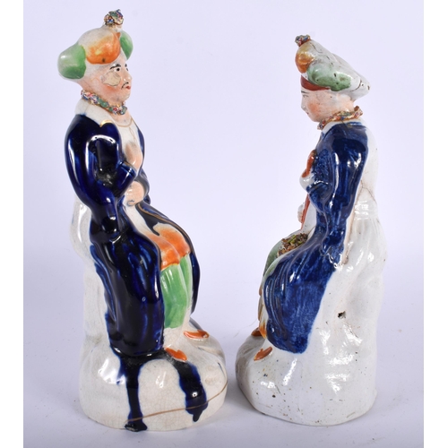 19 - A PAIR OF 19TH CENTURY STAFFORDSHIRE FIGURES OF TURKS. 21 cm high.