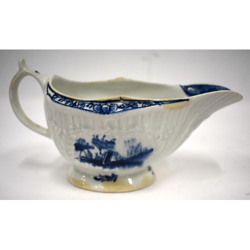 205 - 18th century Lowestoft good sauce boat the loop handle with a spur thumb rest, painted in blue with ... 