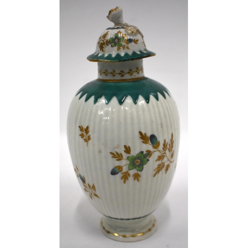 209 - 18th century Worcester tea canister and cover painted in green and gilt flowers on a ribbed body the... 