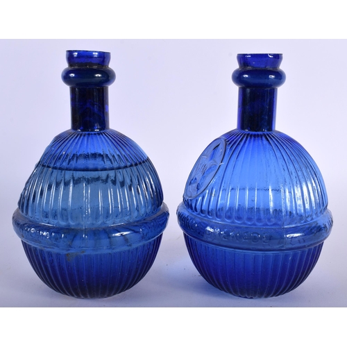21 - TWO STAR BLUE GLASS GRENADE FIRE EXTINGUISHERS. 18 cm x 8 cm. (2) Note: We are unable to ship this l... 