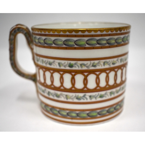 218 - 18th century Champion's Bristol cabinet coffee can and saucer of cylindrical shape, the ear-shaped h... 