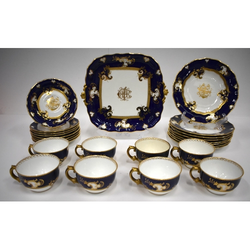 220 - Royal Crown Derby tea service with cobalt blue ground and gilt initials comprising bread and butter ... 