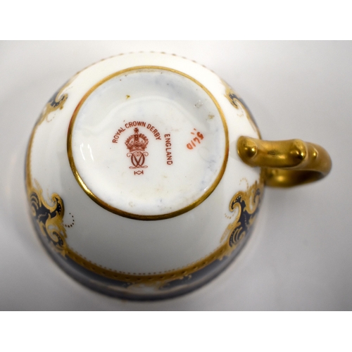 220 - Royal Crown Derby tea service with cobalt blue ground and gilt initials comprising bread and butter ... 