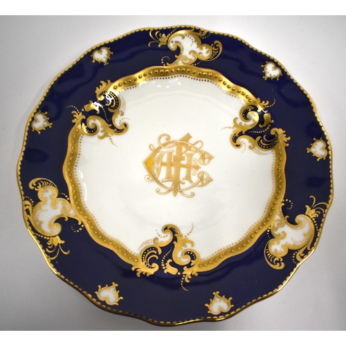 220 - Royal Crown Derby tea service with cobalt blue ground and gilt initials comprising bread and butter ... 