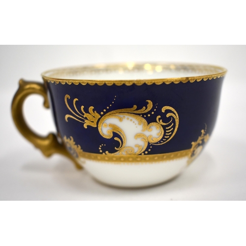 220 - Royal Crown Derby tea service with cobalt blue ground and gilt initials comprising bread and butter ... 