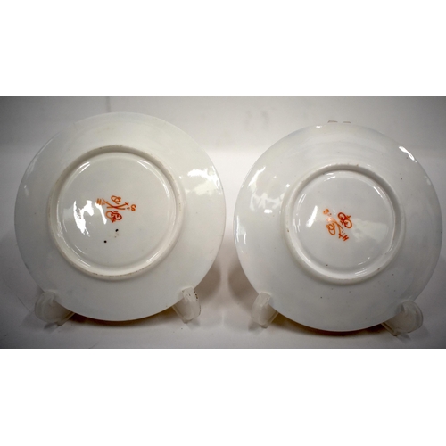 223 - 19th century Derby pair of two handled cups and saucer in an imari pattern, red mark.8cm high