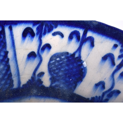 24 - AN EARLY ISLAMIC MIDDLE EASTERN POTTERY DISH. 23 cm wide.