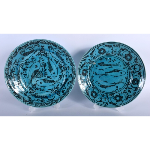 25 - THREE PERSIAN MIDDLE EASTERN BLUE GLAZED DISHES. Largest 23 cm diameter. (3)