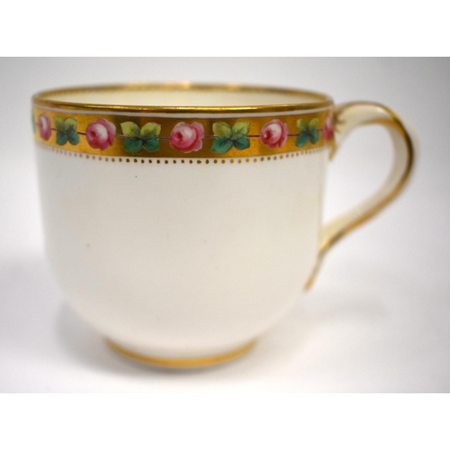 259 - Minton cup and saucer each piece with a gilt and red coronet above floral painted initials 