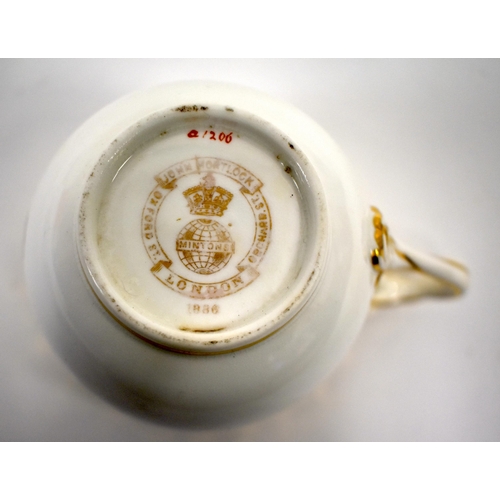 259 - Minton cup and saucer each piece with a gilt and red coronet above floral painted initials 