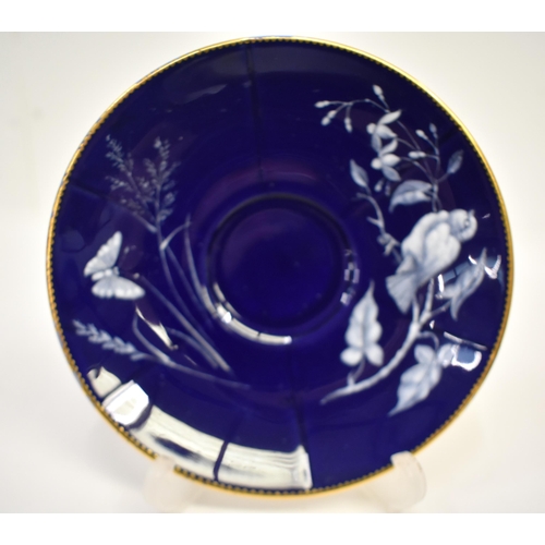 261 - Late 19th/early 20th century Minton pate sur pate cup and saucer with cobalt blue ground decorative ... 