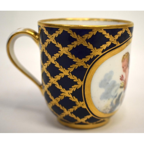 269 - 18th century Sevres coffee cup painted with a cherub on a cloud in an oval panel on a dark blue grou... 