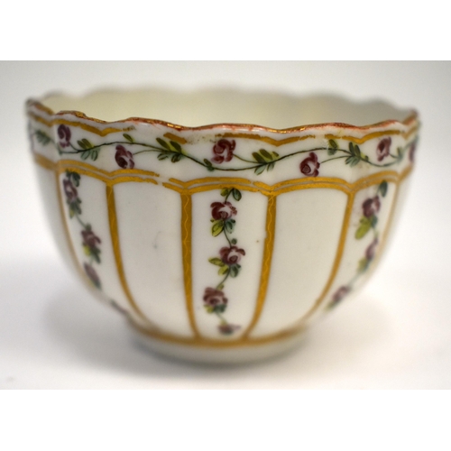 284 - 18th century Bristol teabowl and saucer painted with rose chains in gilt panels, X in blue on teabow... 