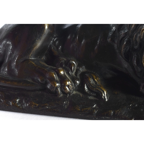 308 - A LOVELY EARLY 19TH CENTURY REGENCY BRONZE MODEL OF A recumbent LION modelled upon a naturalistic ba... 