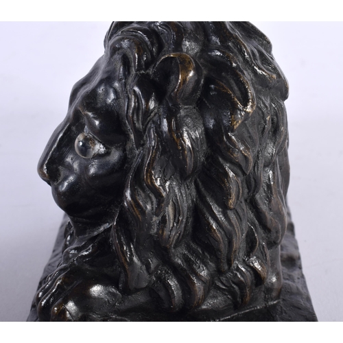 308 - A LOVELY EARLY 19TH CENTURY REGENCY BRONZE MODEL OF A recumbent LION modelled upon a naturalistic ba... 