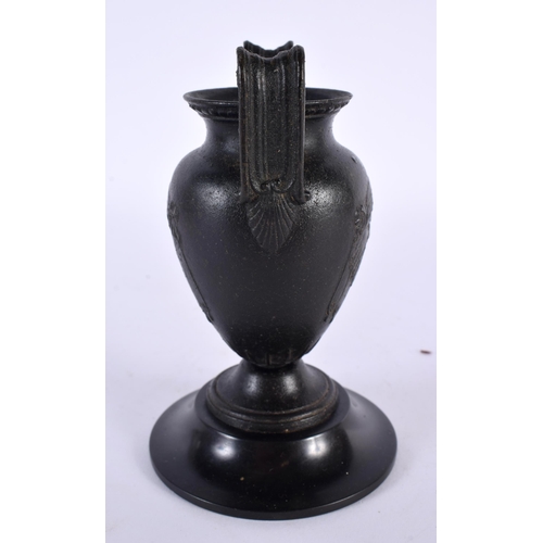 317 - A 19TH CENTURY EUROPEAN TWIN HANDLED GRAND TOUR BRONZE URN After the Antiquity, decorative with bold... 