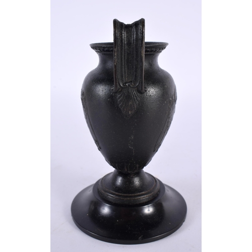 317 - A 19TH CENTURY EUROPEAN TWIN HANDLED GRAND TOUR BRONZE URN After the Antiquity, decorative with bold... 