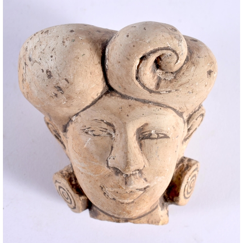 330 - AN EARLY MIDDLE EASTERN INDIAN STUCCO PORTRAIT BUST HEAD modelled with stylised earrings. 9 cm x 7cm... 