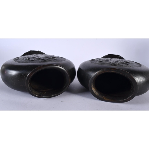 373 - A PAIR OF 19TH CENTURY CHINESE BRONZE PILGRIM MOON FLASKS Qing, decorative with immortals within a c... 