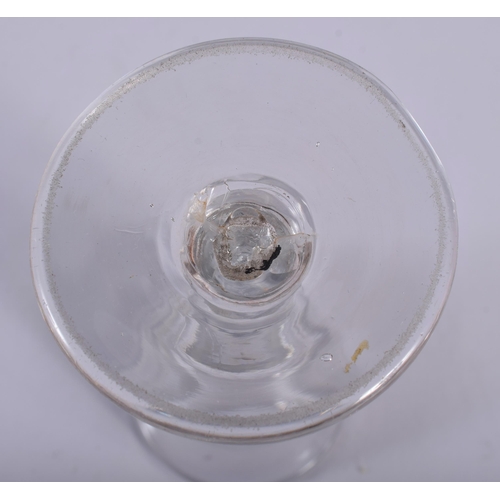 38 - A GEORGE III WINE GLASS together with four glass paperweights. (5)