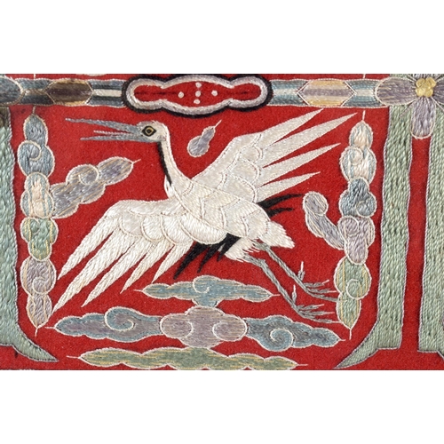 385 - AN UNUSUAL 19TH CENTURY CHINESE RED SILK EMBROIDERED EIGHT CRANE PANEL Qing. 54 cm x 44 cm.