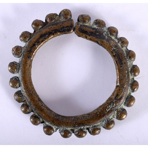 387 - AN EARLY INDIAN SOUTHEAST ASIAN BRONZE CUFF BANGLE together with a marble inlaid dish. Largest 22 cm... 