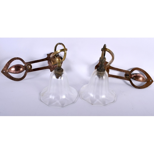 391 - A STYLISH PAIR OF ART NOUVEAU COPPER GLASS HANGING LANTERNS with folding bronze and clear glass shad... 