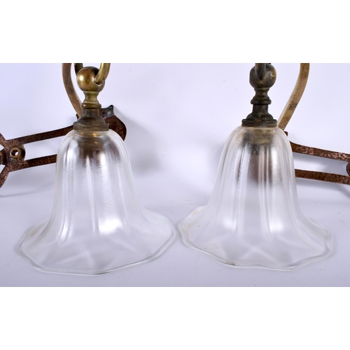 391 - A STYLISH PAIR OF ART NOUVEAU COPPER GLASS HANGING LANTERNS with folding bronze and clear glass shad... 