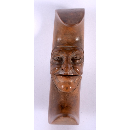 405 - A VERY RARE PAIR OF 19TH CENTURY BAVARIAN NUT CRACKERS formed as the man in the moon. 12 cm x 12 cm.