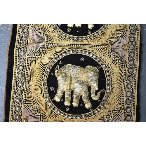 435 - AN INDIAN EMBROIDERED COUNTRY HOUSE ELEPHANT WALL HANGING. 145 cm x 35 cm.