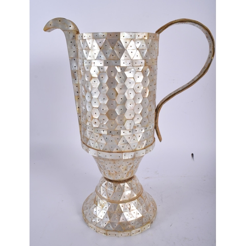 444 - AN INDIAN GOA MOTHER OF PEARL INLAID EWER with stud work decoration. 30 cm x 18 cm.