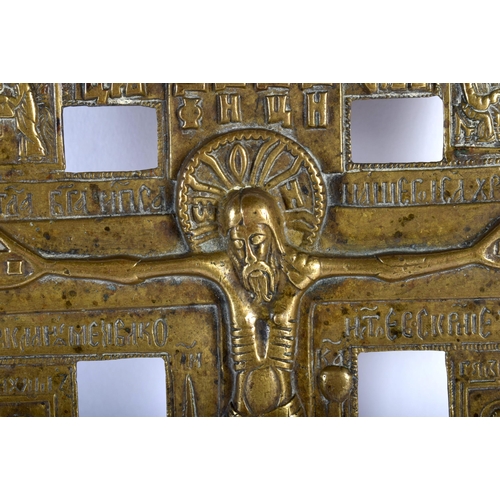 476 - AN 18TH CENTURY RUSSIAN BRONZE CRUCIFIXION ICON modelled with saints in various pursuits, the revers... 