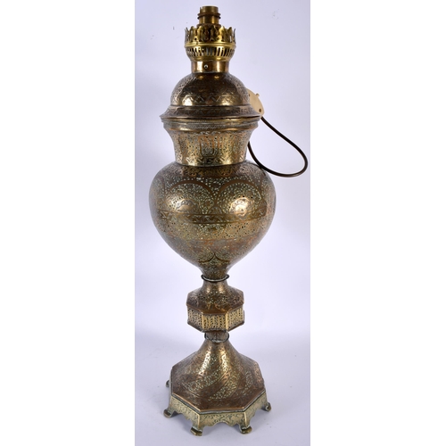 478 - A LARGE 19TH CENTURY INDIAN PERSIAN OPENWORK BRASS VASE AND COVER converted to a European oil lamp, ... 