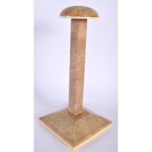 488 - AN ART DECO SHAGREEN WIG STAND with canted square form base. 24 cm high.