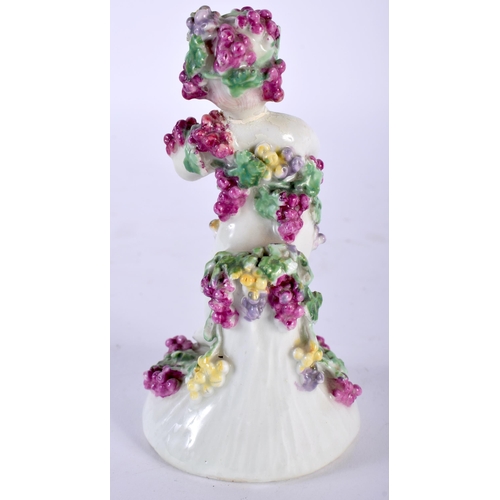 493 - AN 18TH CENTURY ENGLISH PORCELAIN FIGURE OF A PUTTI modelled encrusted in flowers. 13 cm high.