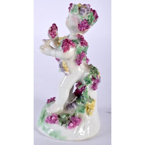 493 - AN 18TH CENTURY ENGLISH PORCELAIN FIGURE OF A PUTTI modelled encrusted in flowers. 13 cm high.